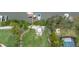 Aerial view of a lush backyard with a private dock, perfect for boating and waterfront enjoyment at 424 Island Cay Way, Apollo Beach, FL 33572