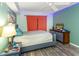 Cozy bedroom with wood-look floors offers space for relaxation and personal style at 424 Island Cay Way, Apollo Beach, FL 33572
