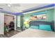 Bright bedroom with wood-look floors features closet space and ample natural light at 424 Island Cay Way, Apollo Beach, FL 33572