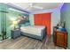 Inviting bedroom with wood-look floors, ceiling fan, and a relaxing coastal vibe at 424 Island Cay Way, Apollo Beach, FL 33572