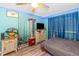 Cozy bedroom features a ceiling fan, wood-look floors and ample storage for fishing gear at 424 Island Cay Way, Apollo Beach, FL 33572