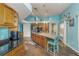 Bright, open kitchen features custom cabinetry, stainless steel appliances, and blue accent walls at 424 Island Cay Way, Apollo Beach, FL 33572