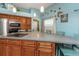 Spacious kitchen showcasing a cooktop island, stylish countertops, and stainless steel appliances at 424 Island Cay Way, Apollo Beach, FL 33572