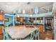 Spacious kitchen featuring a large center island, custom cabinetry, and blue accent paint at 424 Island Cay Way, Apollo Beach, FL 33572