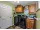 Functional laundry room with modern washer and dryer, storage cabinets, and sink at 424 Island Cay Way, Apollo Beach, FL 33572