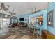 Open concept living room with a leather sectional, bar seating, and modern ceiling fan at 424 Island Cay Way, Apollo Beach, FL 33572