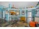 Open-concept living room with slate floors, breakfast bar and bright and airy atmosphere at 424 Island Cay Way, Apollo Beach, FL 33572