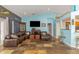 Comfortable living room features tile flooring, a leather sofa, and contemporary decor at 424 Island Cay Way, Apollo Beach, FL 33572