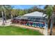Aerial shot showcases the screened-in pool area, adorned with beautiful landscaping, creating a private oasis at 424 Island Cay Way, Apollo Beach, FL 33572