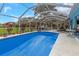 The property boasts an inviting enclosed pool and patio area, ideal for outdoor living and entertainment at 424 Island Cay Way, Apollo Beach, FL 33572