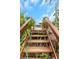 Wooden stairs leading up through lush greenery to a patio with a view of the property at 424 Island Cay Way, Apollo Beach, FL 33572