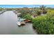 Aerial view of a waterfront property featuring a private dock and waterway access at 424 Island Cay Way, Apollo Beach, FL 33572