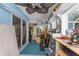 A cluttered workshop featuring tools, storage shelves, and a workbench for hobbies and projects at 424 Island Cay Way, Apollo Beach, FL 33572