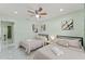 Bright bedroom featuring two beds, neutral decor, and modern lighting creating a relaxing space at 439 E Boyer St, Tarpon Springs, FL 34689