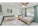 Comfortable bedroom with two beds, side tables, and tasteful decor for a restful night's sleep at 439 E Boyer St, Tarpon Springs, FL 34689