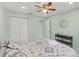 Bright bedroom featuring ample closet space, a neutral color scheme, and modern decor at 439 E Boyer St, Tarpon Springs, FL 34689