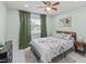 Inviting bedroom with a cozy bed, decorative pillows, and stylish furnishings for a relaxing retreat at 439 E Boyer St, Tarpon Springs, FL 34689