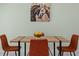 Cozy dining room with modern table, chairs, and unique horse artwork creates a welcoming space for meals at 439 E Boyer St, Tarpon Springs, FL 34689