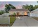 Charming single-story home featuring a cozy front porch and well-maintained landscaping at 439 E Boyer St, Tarpon Springs, FL 34689