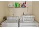Functional laundry room features a washer, dryer, and ample storage space at 439 E Boyer St, Tarpon Springs, FL 34689