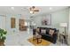 Bright and airy living room featuring modern decor, a ceiling fan, and an open layout at 439 E Boyer St, Tarpon Springs, FL 34689
