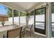 Relaxing screened porch with comfortable seating, providing a serene outdoor living space at 439 E Boyer St, Tarpon Springs, FL 34689