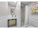Contemporary bathroom with a pedestal sink, walk-in shower, and modern fixtures at 4701 Rambling River Rd, Brandon, FL 33511