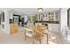 Cozy dining area featuring white cabinets, butcher block counters and a rustic wood table at 4701 Rambling River Rd, Brandon, FL 33511
