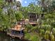 Stunning modern home with a private dock on the river, surrounded by lush tropical foliage at 4701 Rambling River Rd, Brandon, FL 33511