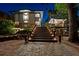 Exterior view of the home at night with illuminated steps leading to the front entrance at 4701 Rambling River Rd, Brandon, FL 33511