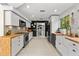 Modern kitchen with stainless steel appliances, butcher block countertops, and mosaic tile backsplash at 4701 Rambling River Rd, Brandon, FL 33511