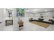 Spacious living room with white shiplap walls, tile flooring, a sink, and comfortable seating area at 4701 Rambling River Rd, Brandon, FL 33511