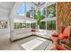 Bright, modern living room with floor-to-ceiling windows and stylish furniture at 4701 Rambling River Rd, Brandon, FL 33511