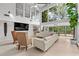 Spacious living room with vaulted ceilings, modern furniture, and expansive windows at 4701 Rambling River Rd, Brandon, FL 33511