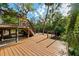 Gorgeous outdoor deck overlooking the lush scenery with stairs leading down to the river at 4701 Rambling River Rd, Brandon, FL 33511
