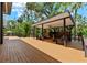 Expansive wooden deck featuring an outdoor seating area with a covered gazebo at 4701 Rambling River Rd, Brandon, FL 33511