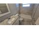 Well-lit bathroom with a bathtub and shower combination, updated vanity, and neutral paint throughout at 4750 Panorama Ave, Holiday, FL 34690