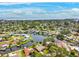 Picturesque aerial view of a waterfront neighborhood showcasing canal access, private docks, and lush greenery with ocean views at 5201 Dover Ne St, St Petersburg, FL 33703