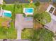 Aerial view showcasing the home's pool, landscaping, and proximity to the canal at 5201 Dover Ne St, St Petersburg, FL 33703