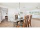 Dining room featuring a glass-top table with seating for four and natural light at 5201 Dover Ne St, St Petersburg, FL 33703