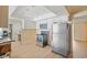 Efficient kitchen featuring stainless steel appliances, white cabinets, and tile flooring at 5201 Dover Ne St, St Petersburg, FL 33703