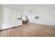 Bright and airy living room with hardwood floors, built-in shelving, with dining area at 5201 Dover Ne St, St Petersburg, FL 33703