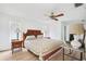 Comfortable bedroom featuring laminate floors, a ceiling fan, and ample natural light at 5201 Dover Ne St, St Petersburg, FL 33703