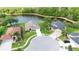 Residential neighborhood showcasing a single-story home with a well-kept lawn and pond views in the backyard at 5331 Villagebrook Dr, Wesley Chapel, FL 33544
