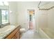 Bathroom featuring granite counters and a view of the outdoor lanai at 5331 Villagebrook Dr, Wesley Chapel, FL 33544