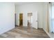 Bright room with hard surface floors and views to the bath and walk-in closet at 5331 Villagebrook Dr, Wesley Chapel, FL 33544