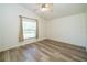 Hard surface flooring featured in this light and bright bedroom at 5331 Villagebrook Dr, Wesley Chapel, FL 33544