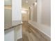 Hallway with a view to the entry door and decor niches at 5331 Villagebrook Dr, Wesley Chapel, FL 33544