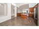 Bright kitchen featuring an island, granite countertops, and stainless steel appliances at 5331 Villagebrook Dr, Wesley Chapel, FL 33544
