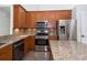 Kitchen with granite countertops, stainless steel appliances, and tile backsplash at 5331 Villagebrook Dr, Wesley Chapel, FL 33544